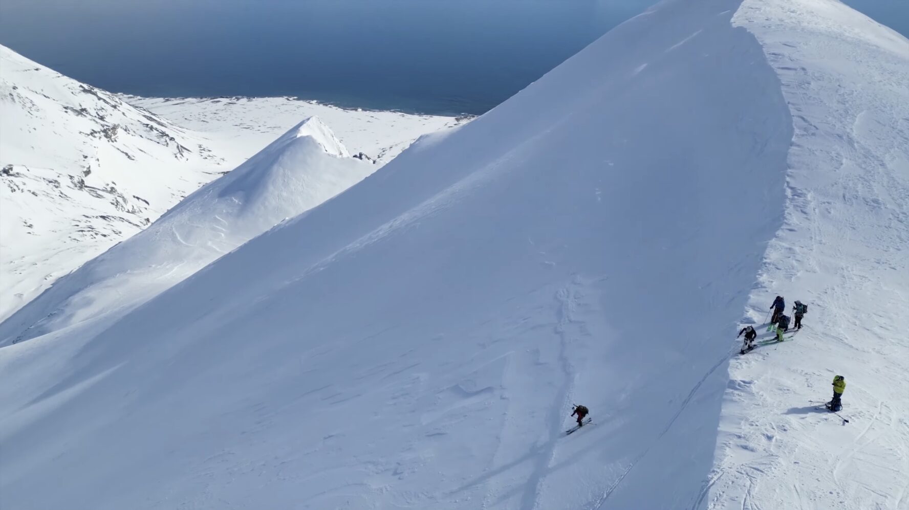 Skiers on a ridge in Svalbard