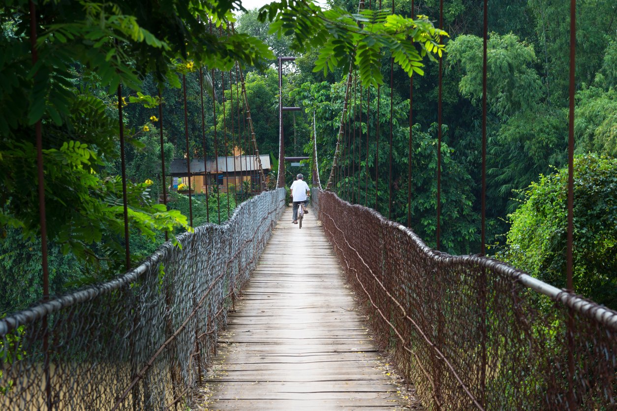 Biking over a bridge in Battambang