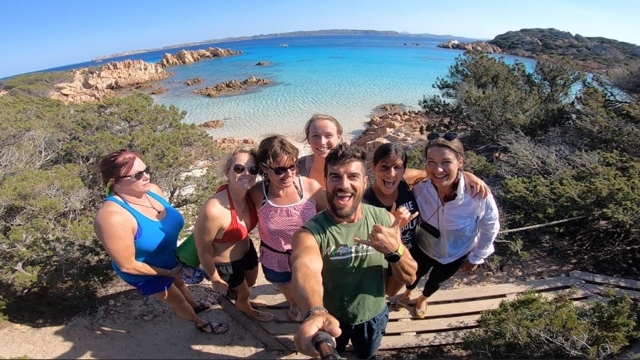 Happy group taking a selfie in Sardinia