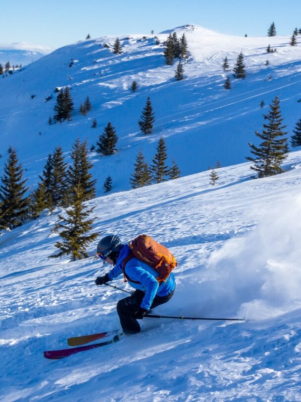 Giving the skis to skiers from a snowcat in Macedonia