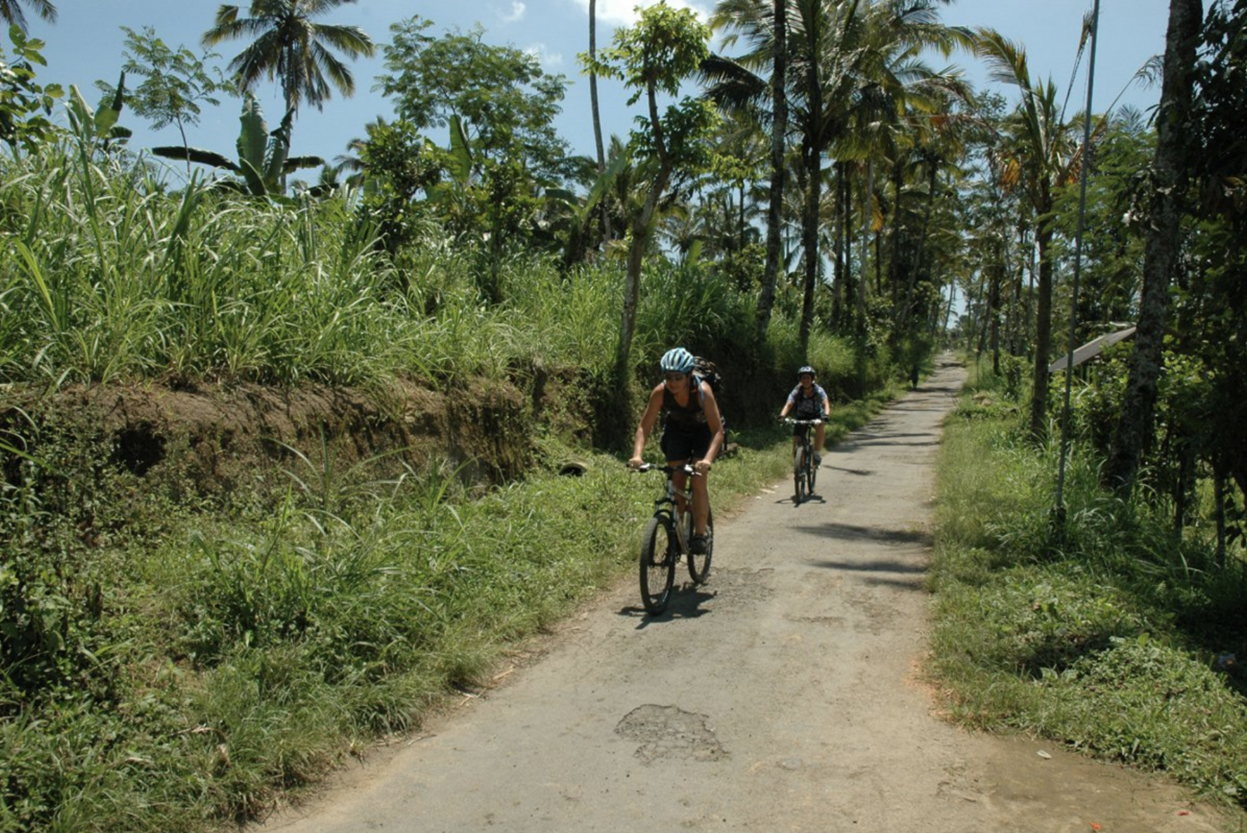 Bikers cycling on a path in Bali