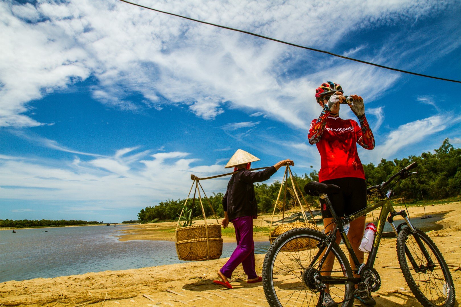 Cycling and taking photo on a beach in Vietnam