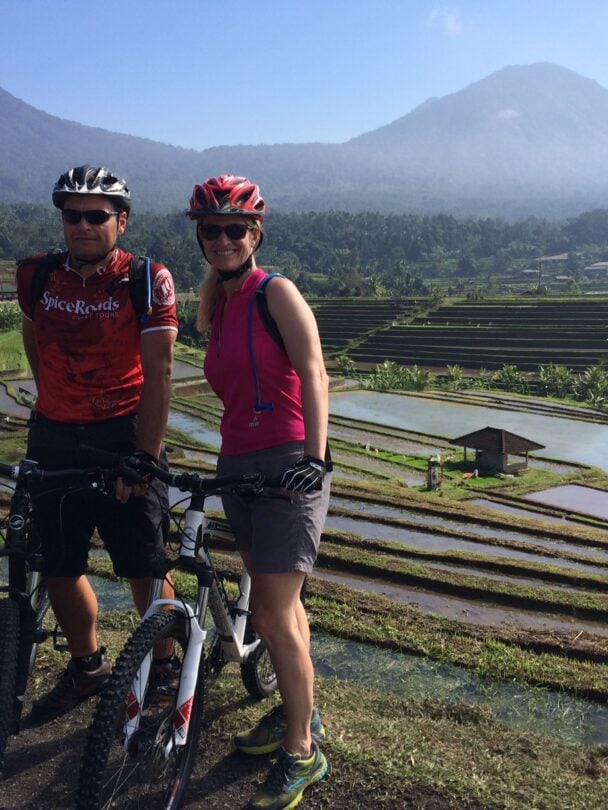 Bikers cycling through a field in Bali