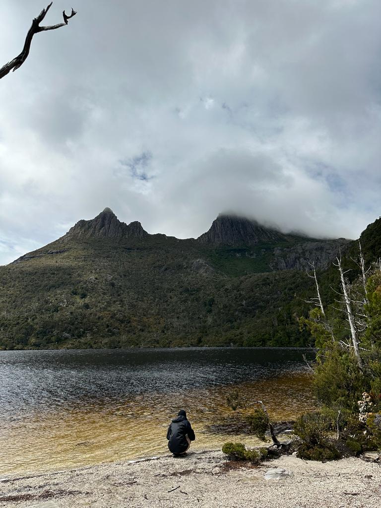 Hiker on a lake in Tasmania