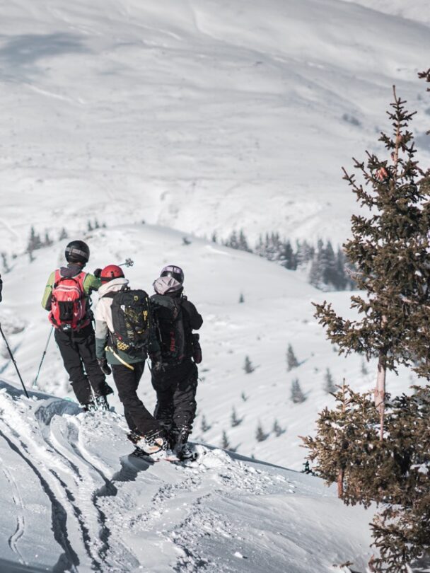Giving the skis to skiers from a snowcat in Macedonia