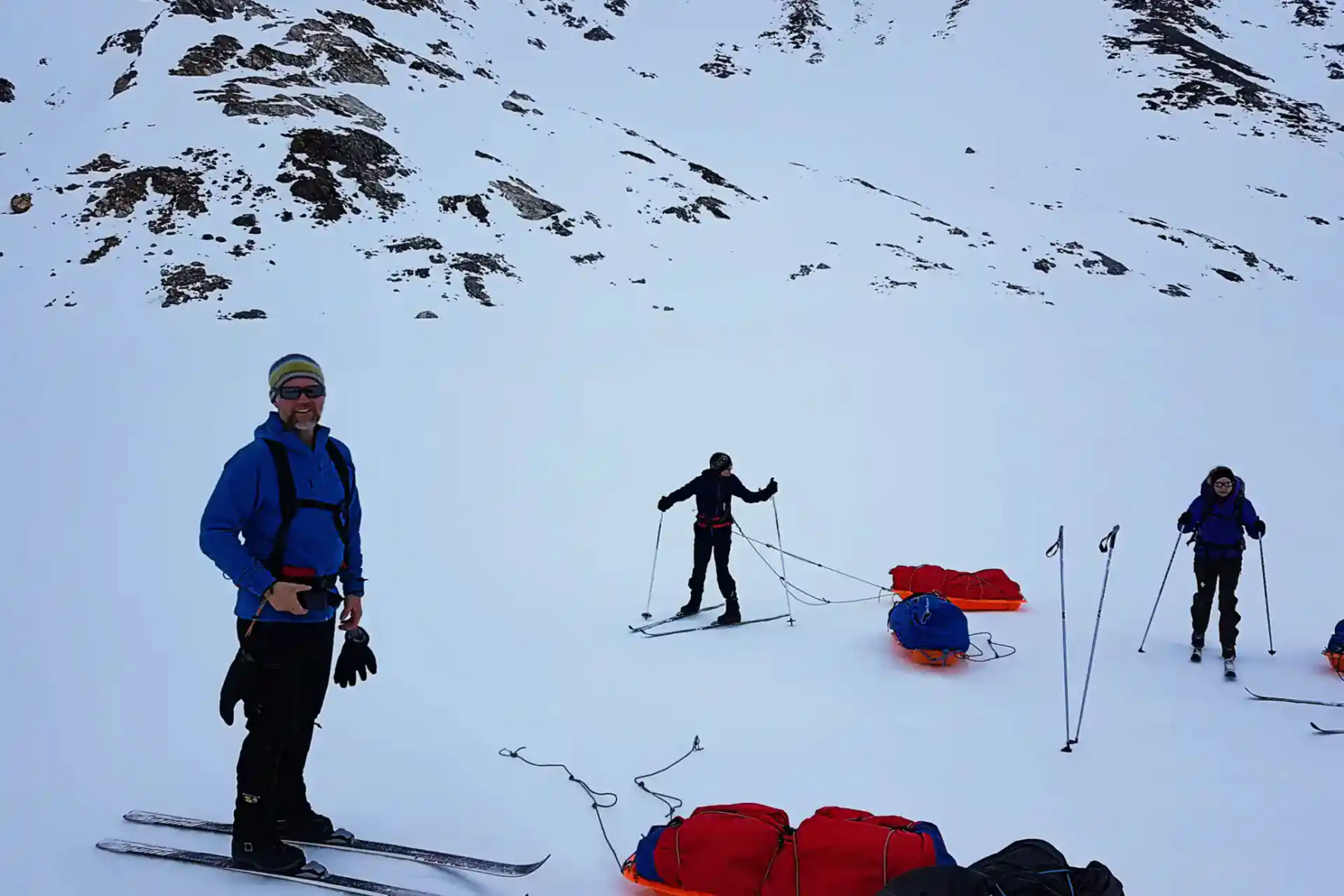 Three people cross-country skiing in East Greenland