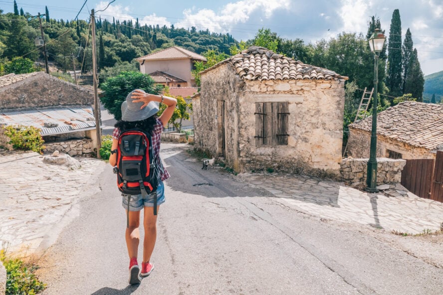 Tourist with hat having fun and enjoying vacations in Zakynthos Greece