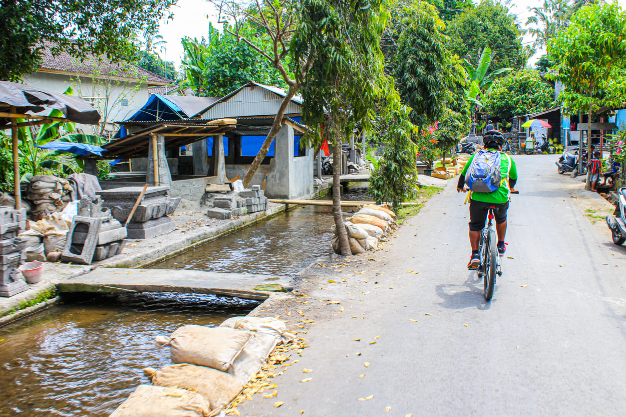 Riding a bicycle in Ubud village in Bali