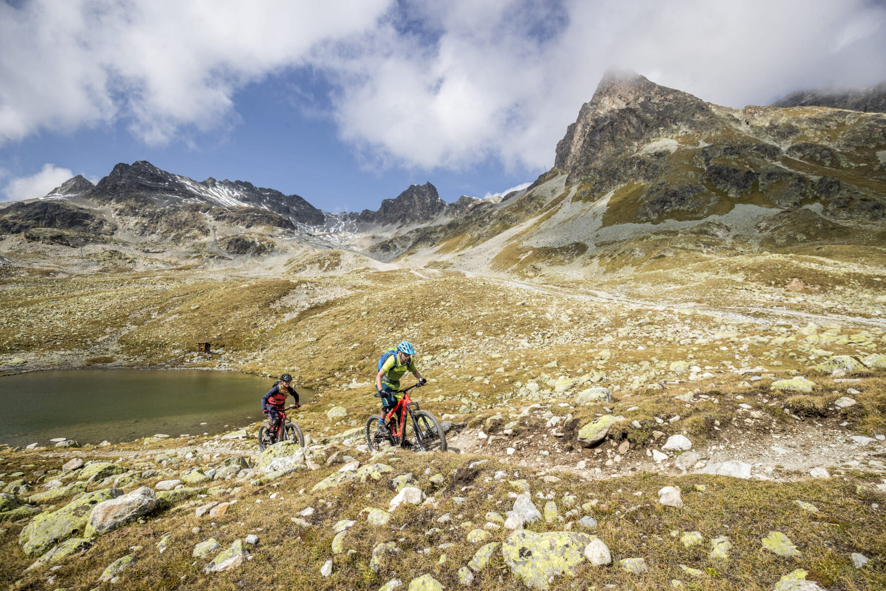 Bikers on a rocky path