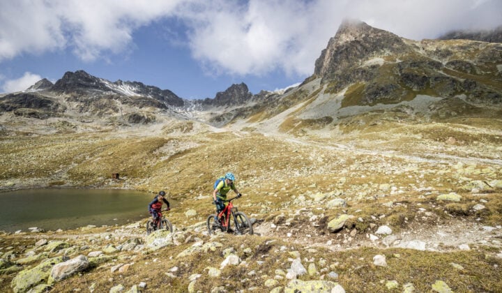 Bikers on a rocky path