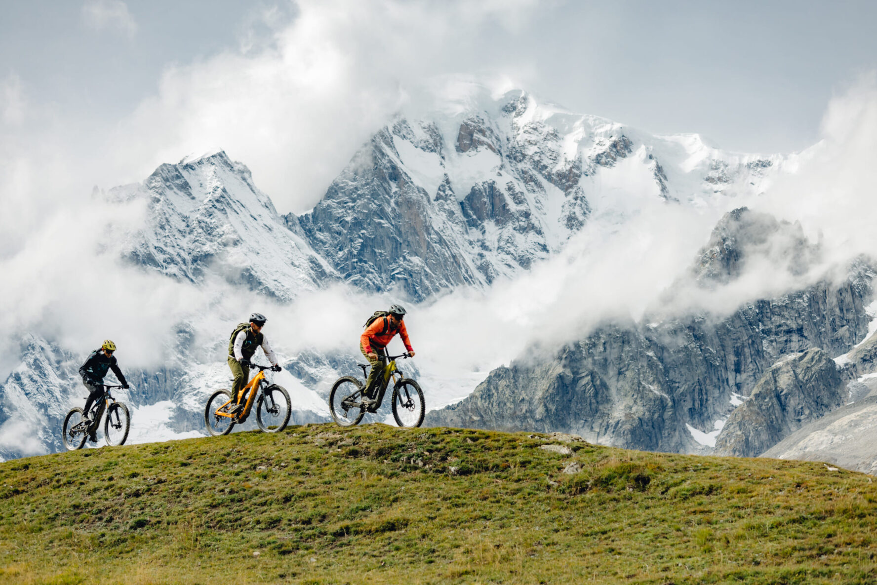 Biking with mountains in the background