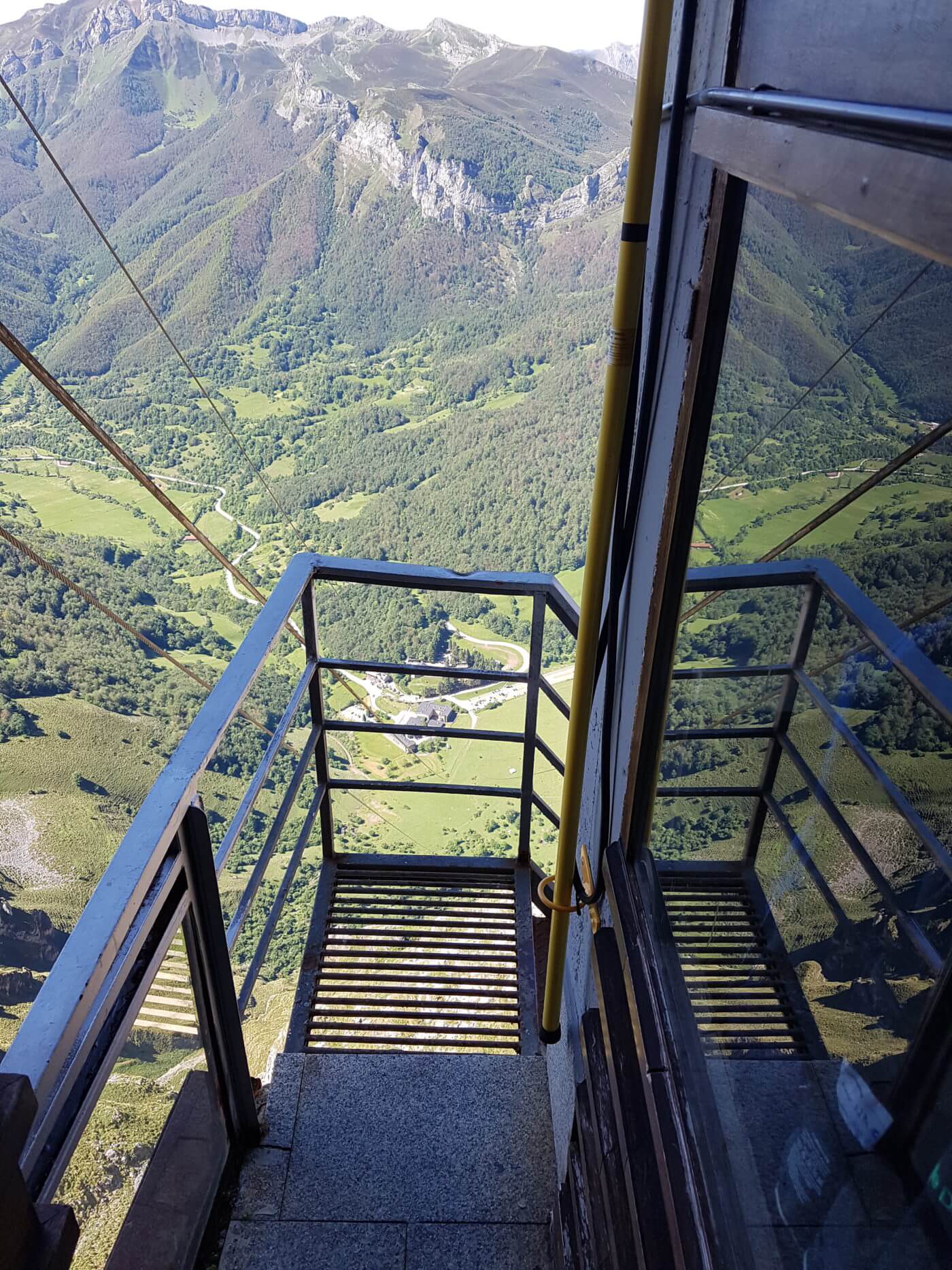 View of the valley and mountains from the cable car in Fuente De