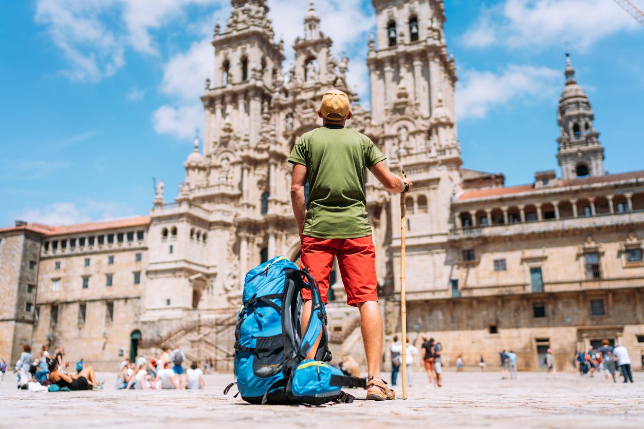 Hiker in front of the cathedral in Santiago