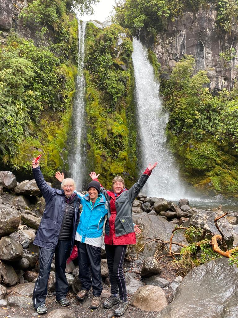 Hikers near a waterfall