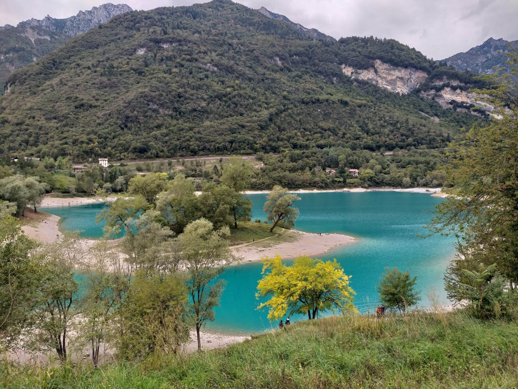 Charming cobblestone alley with old stone buildings in Canale di Tenno