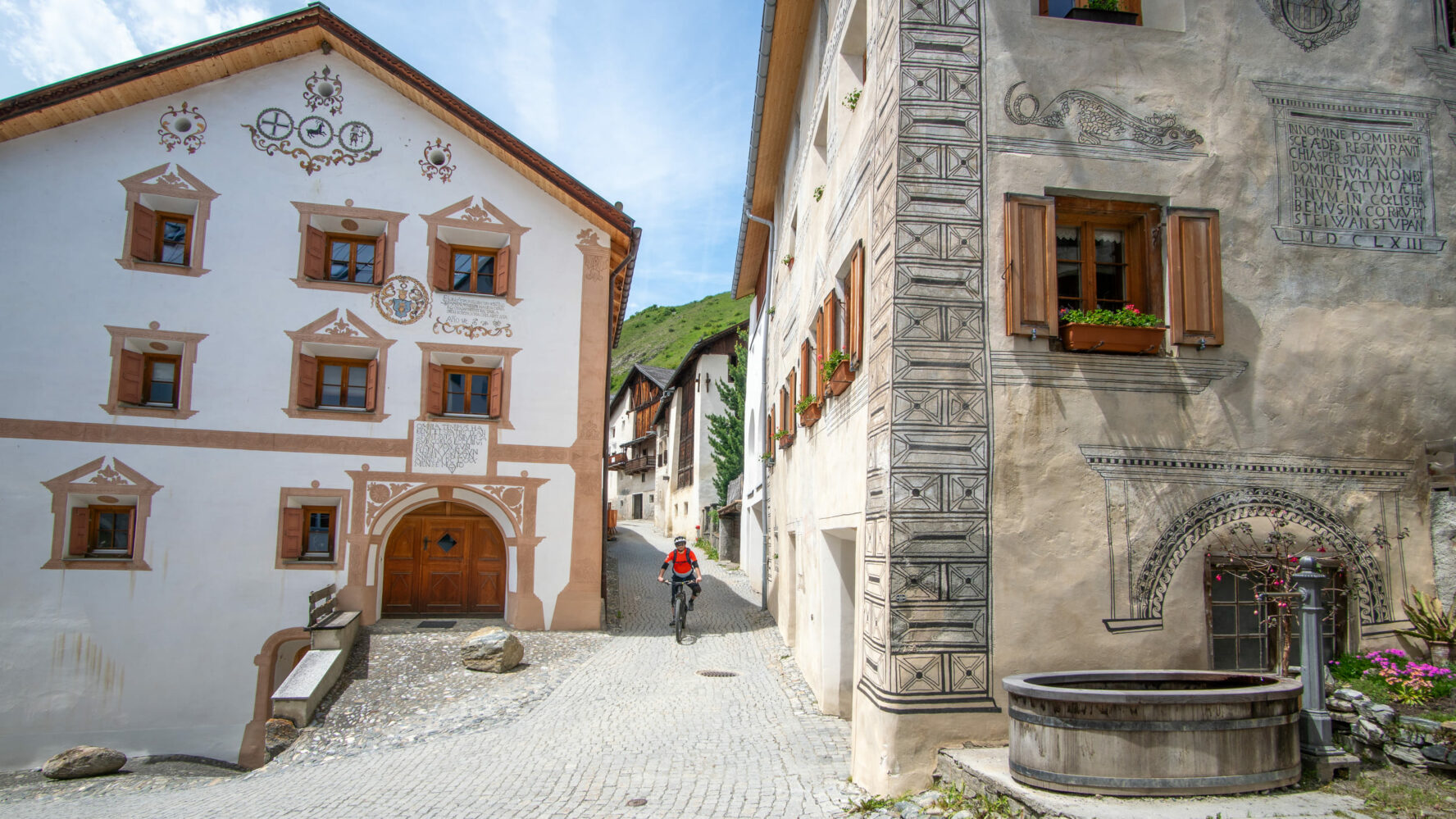 Riding through town in the Alps