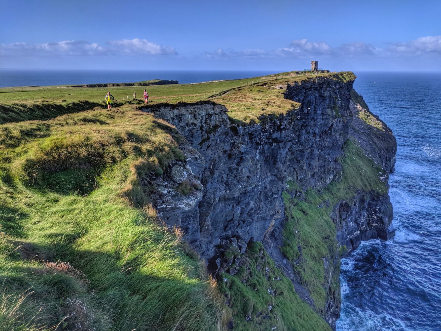 Runners on a cliff