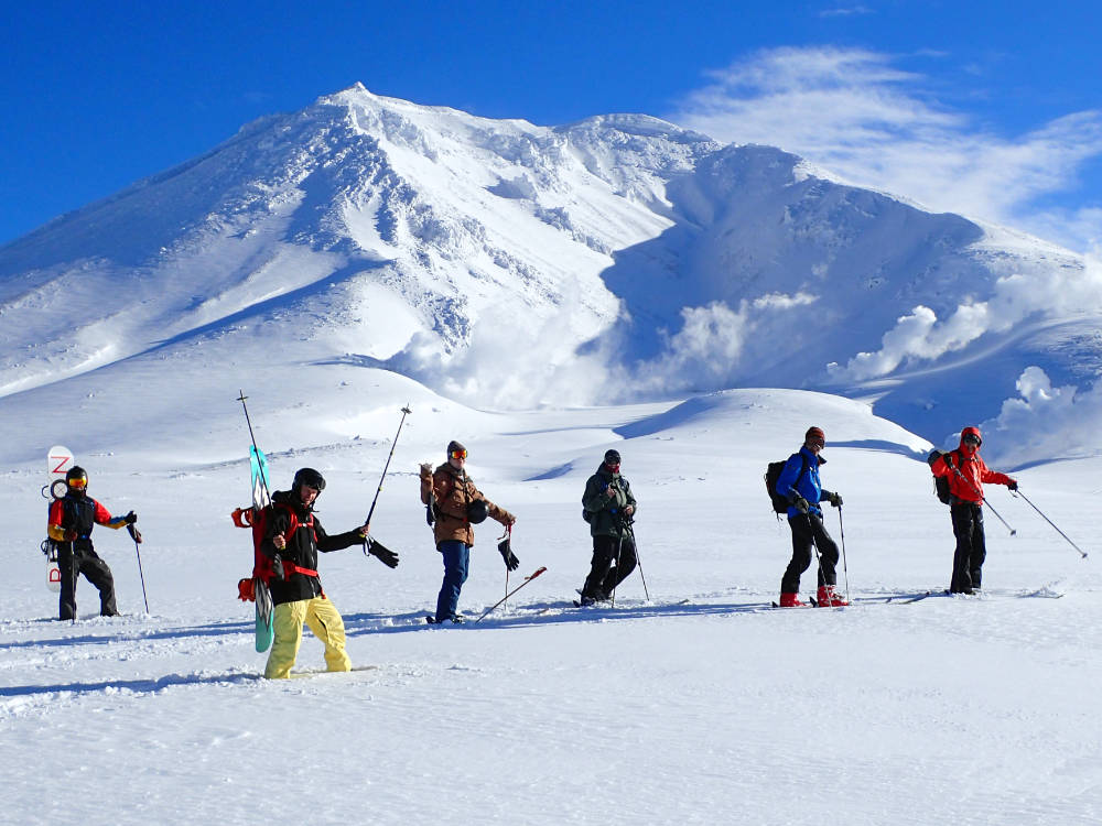 Skiers walking in snow