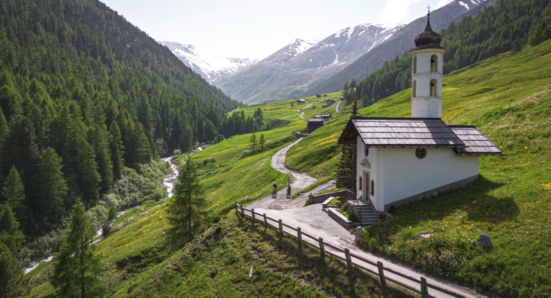 Two cyclists on a bike holiday in the Alps