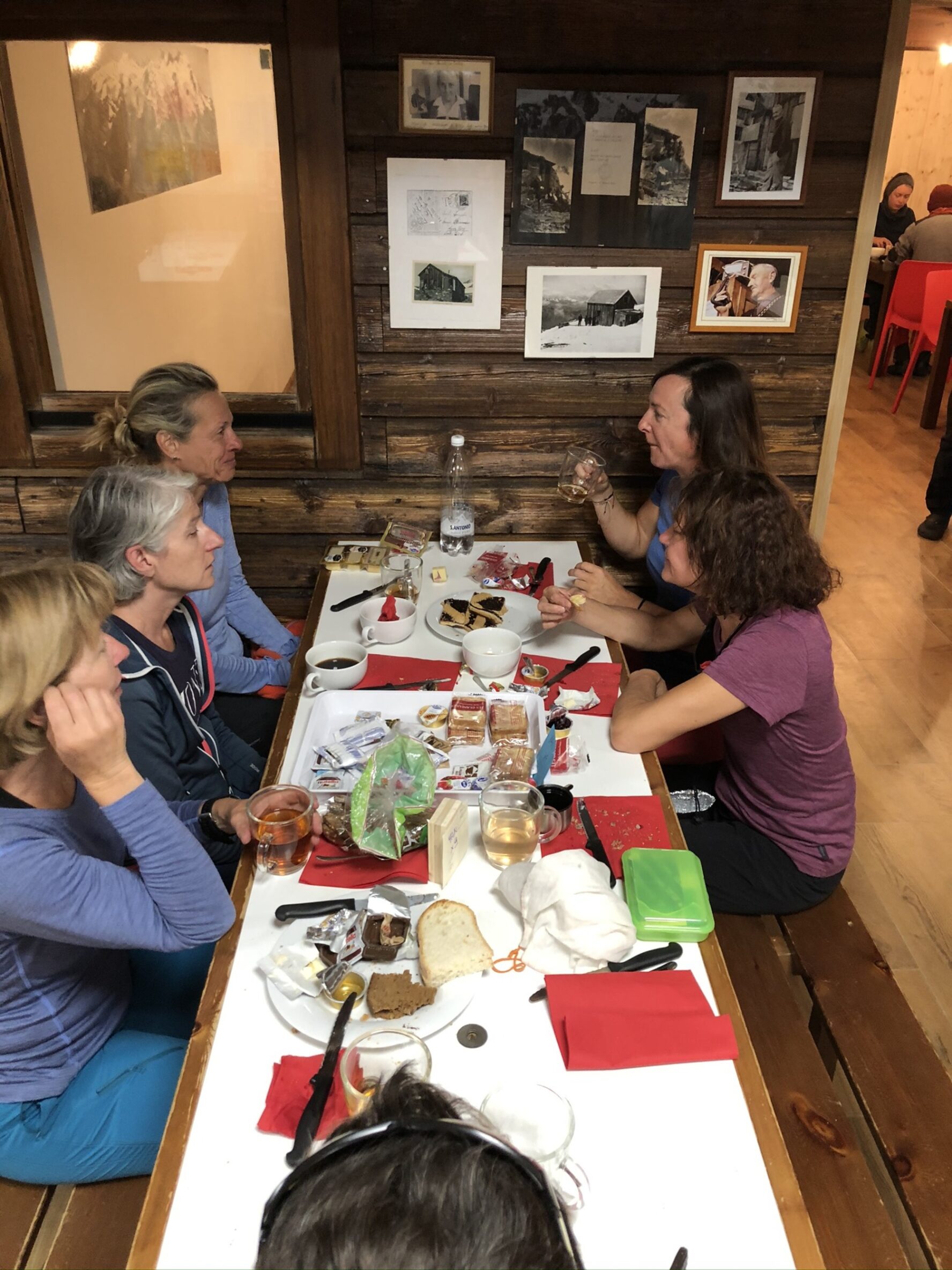 Women hikers dining and talking