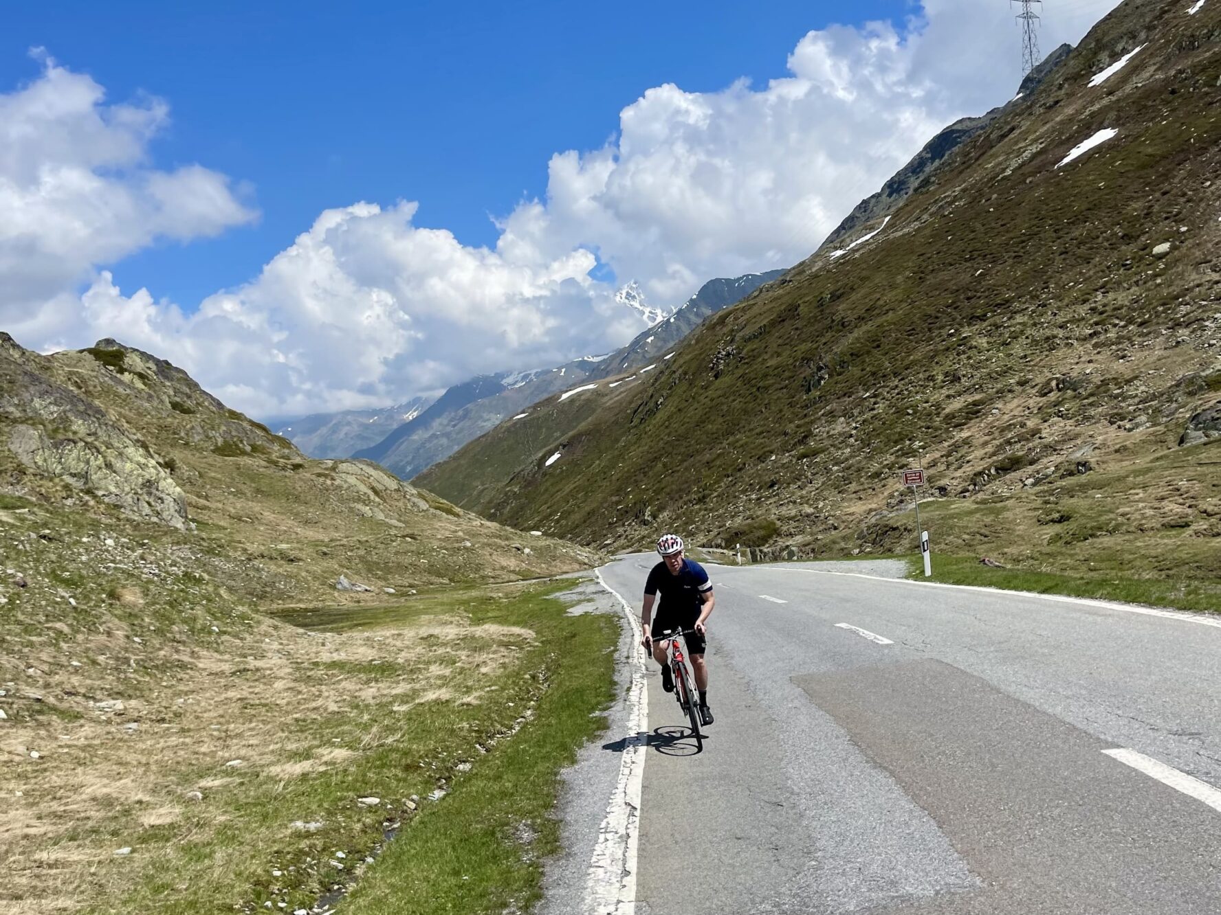 Cyclist in the Alps on a sunny day