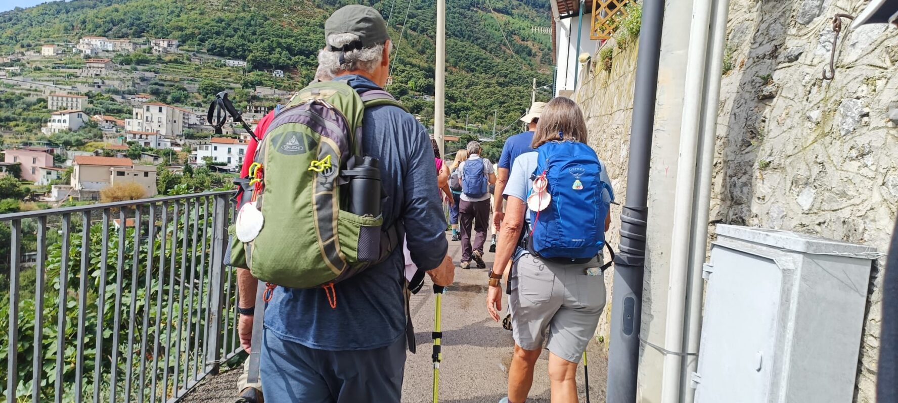 Hikers walking through a Camino village