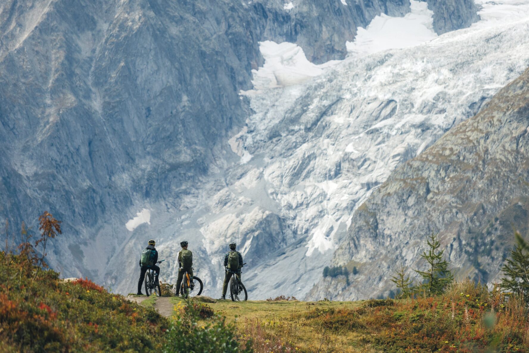 Riders resting near a glacier in the Mont Blanc area