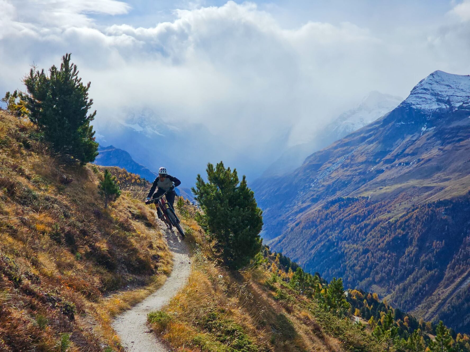 Mountain biker riding in the Swiss Alps