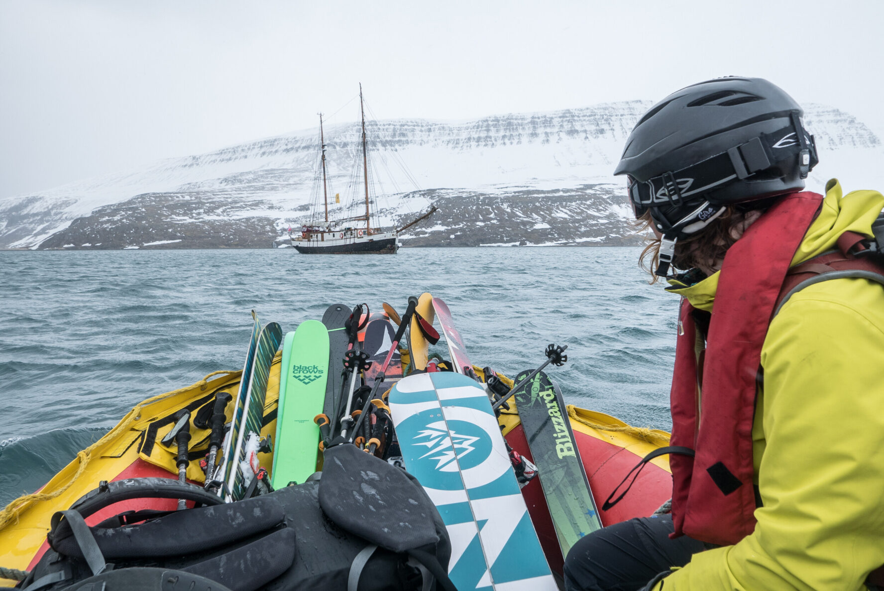 A skier and skiing equipment in a dinghy