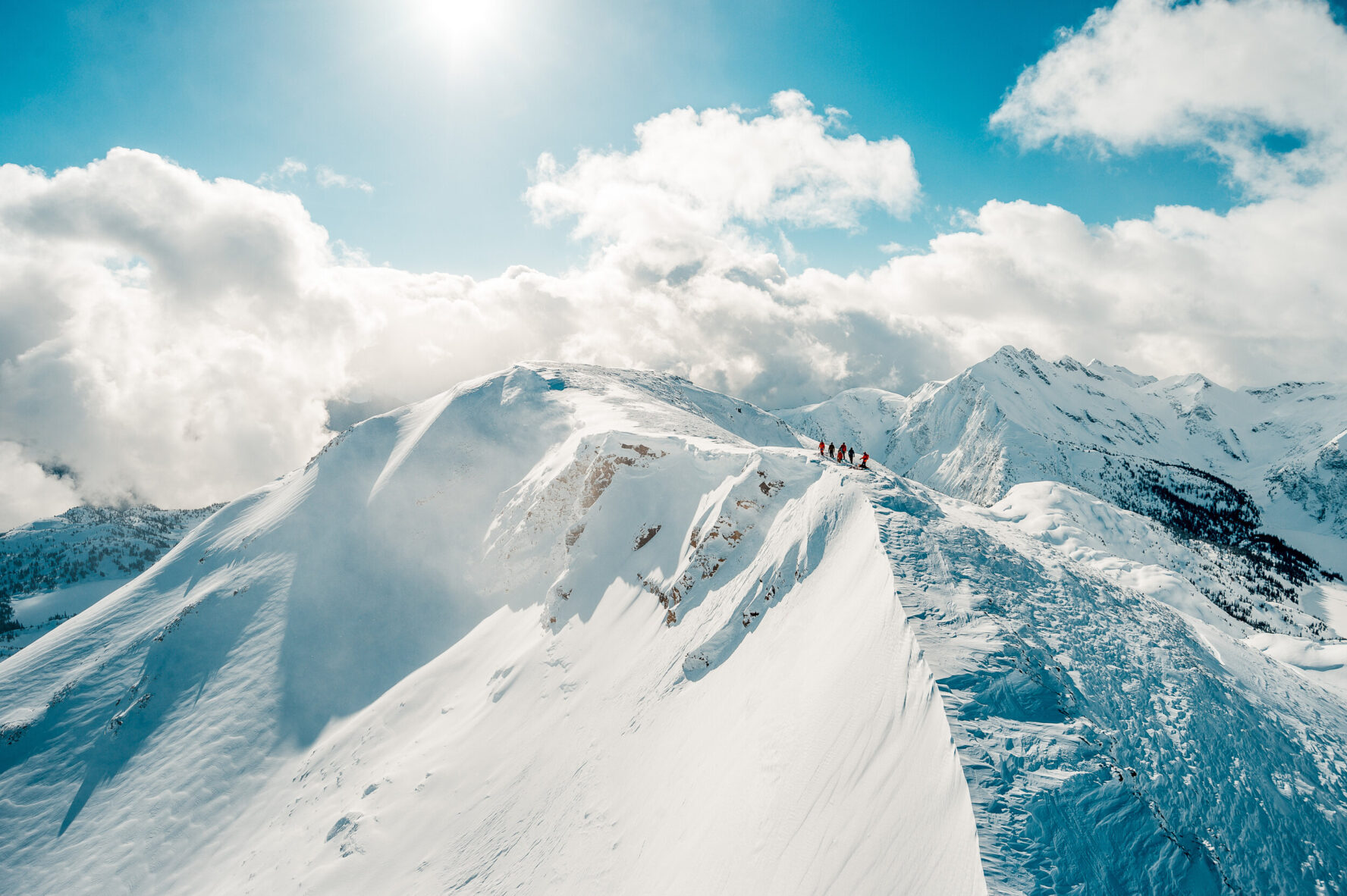 Skiers on a mountain ridge