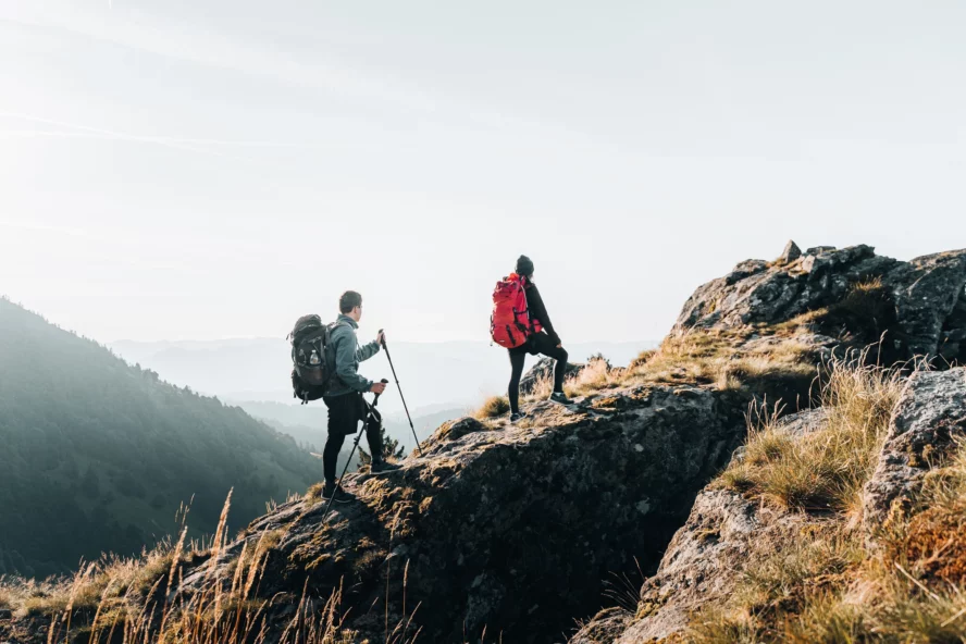 A couple using hiking poles on the Tour du Mont Blanc