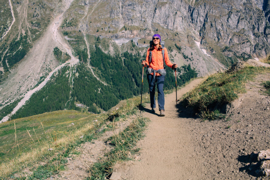 A hiker wearing layers along the Tour du Mont Blanc
