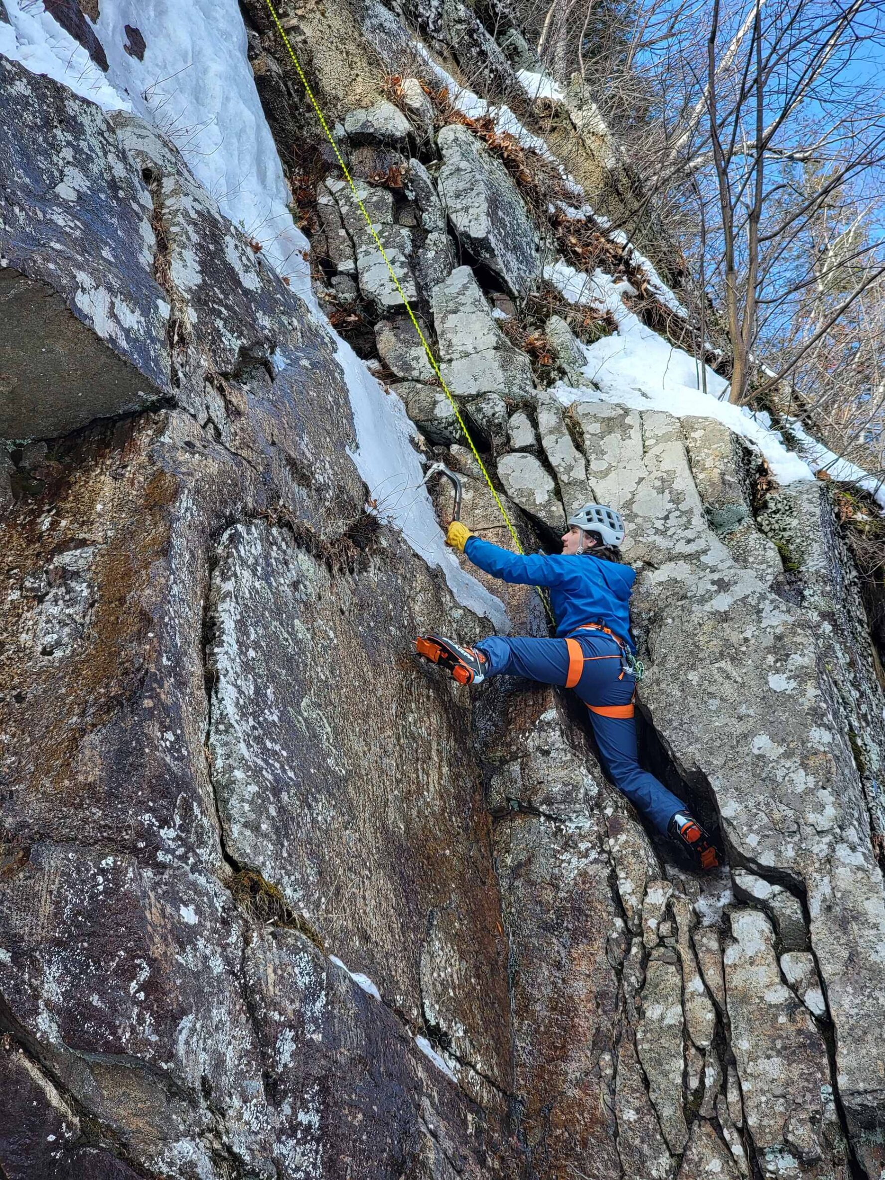 Climbing a rocky surface with ice patches