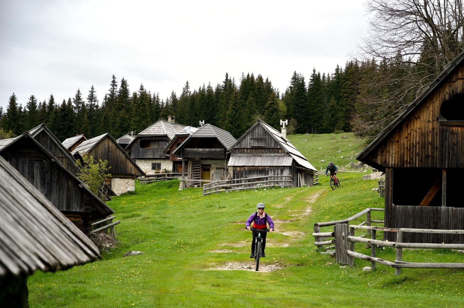e-MTB between huts in a settlement in Slovenia