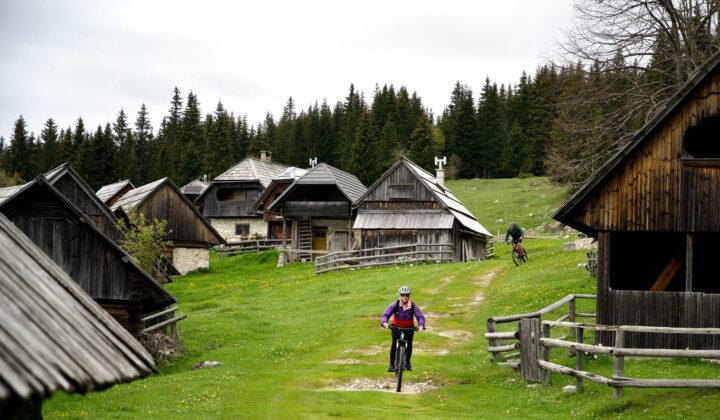 e-MTB between huts in a settlement in Slovenia