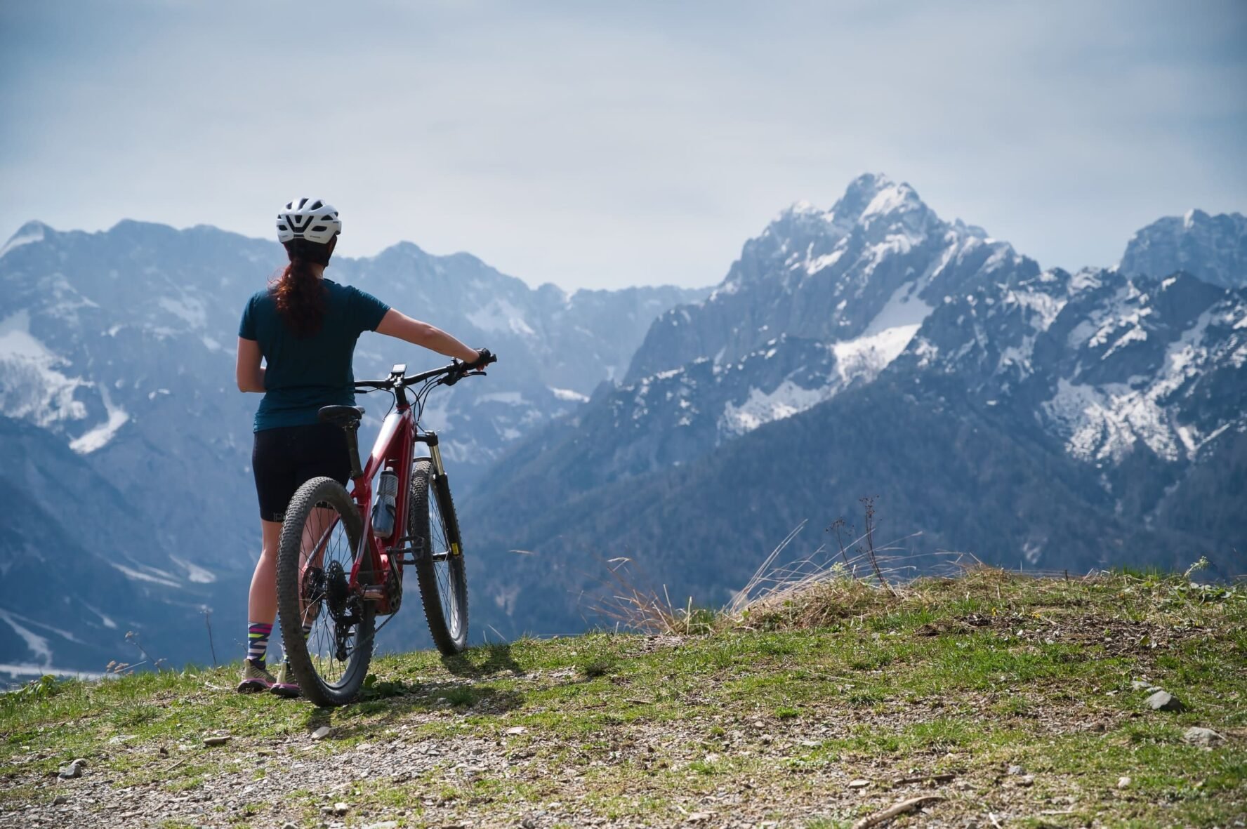Biker looking at Alpine peaks on a break from the Slovenia hiking & e-MTB trip