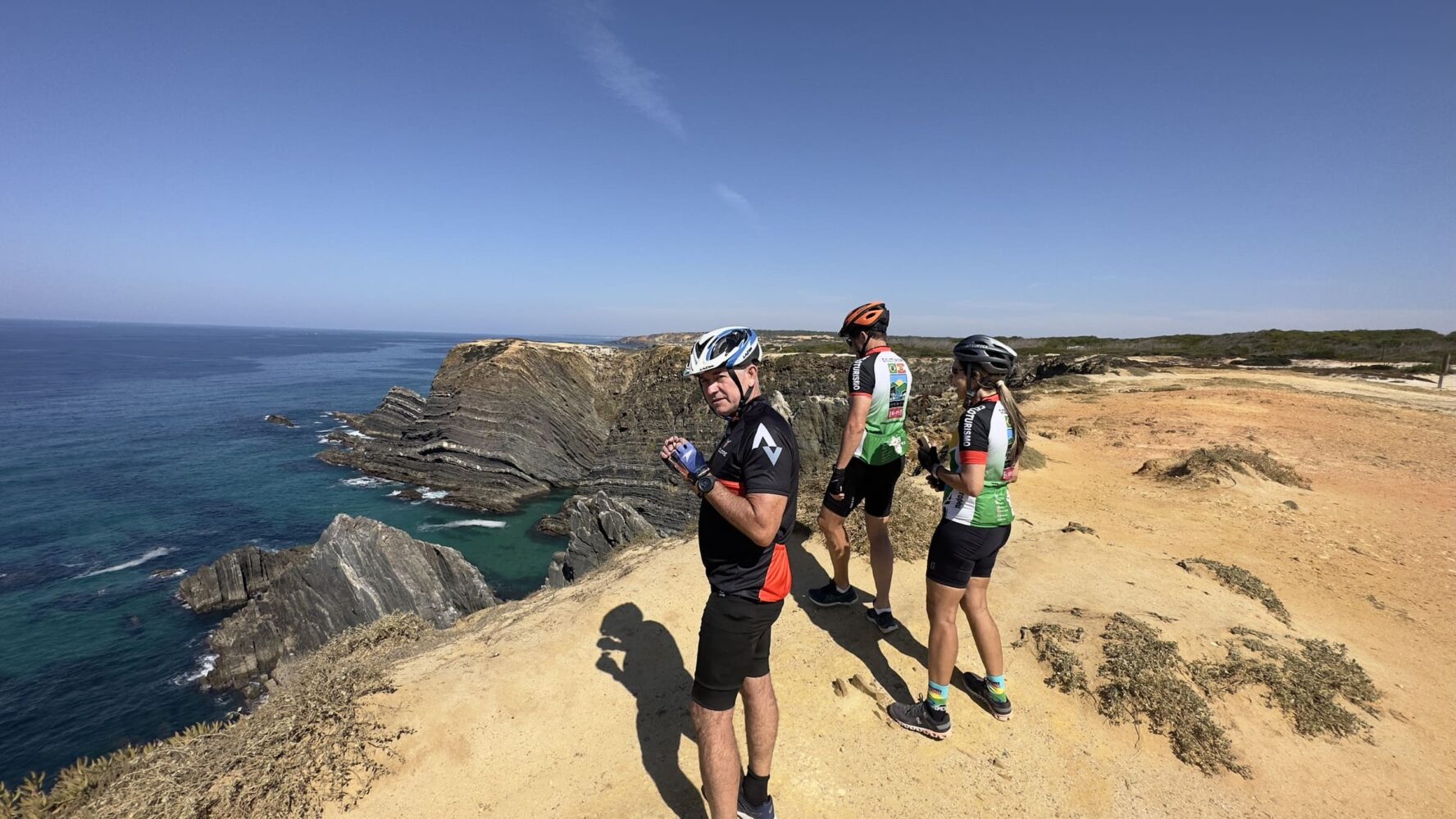 Cyclists on a cliff