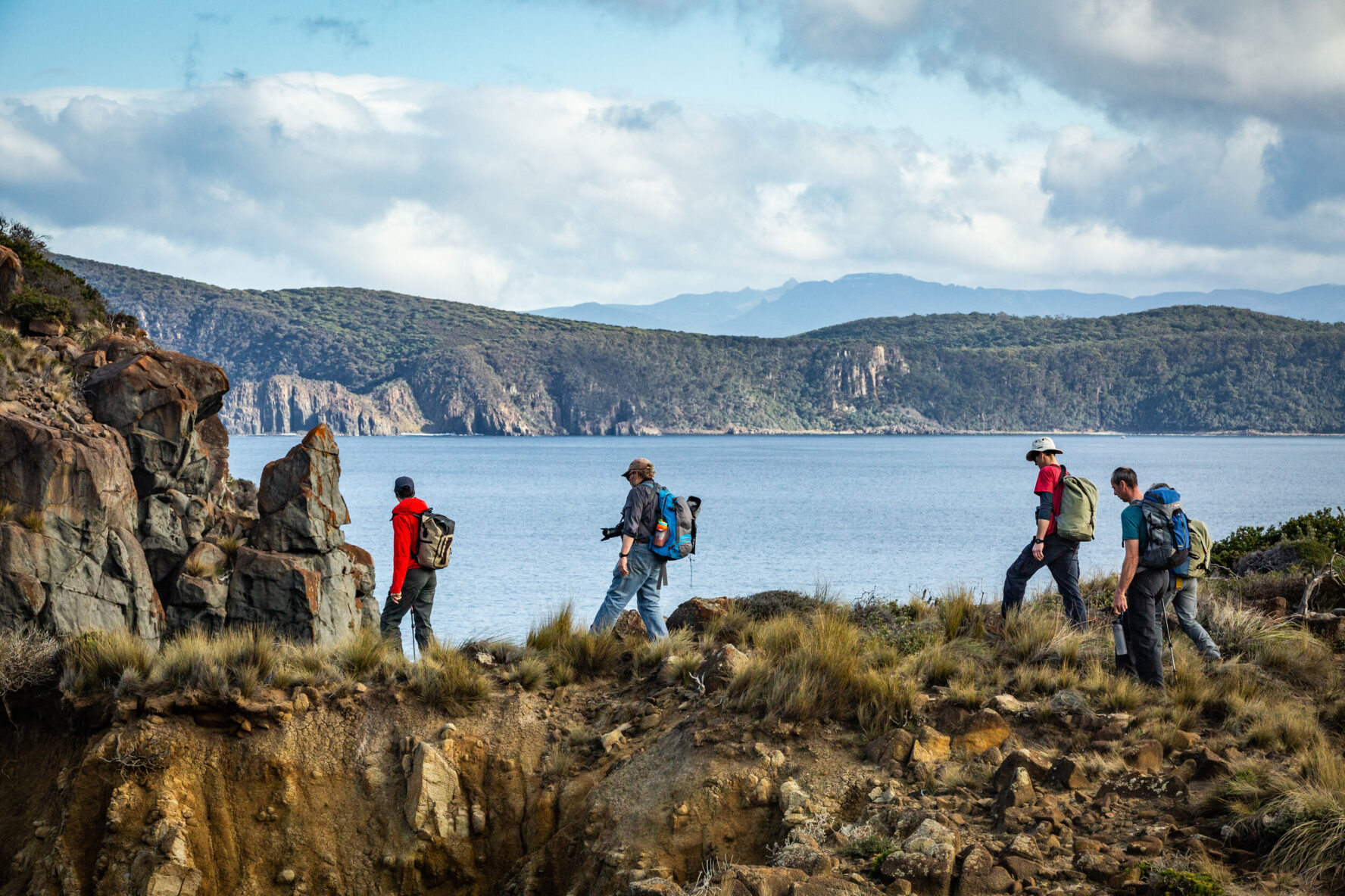 Group hiking with views of Bruny Island surroundings