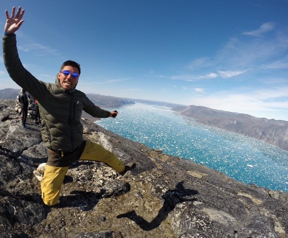 Hiker jumping in Greenland