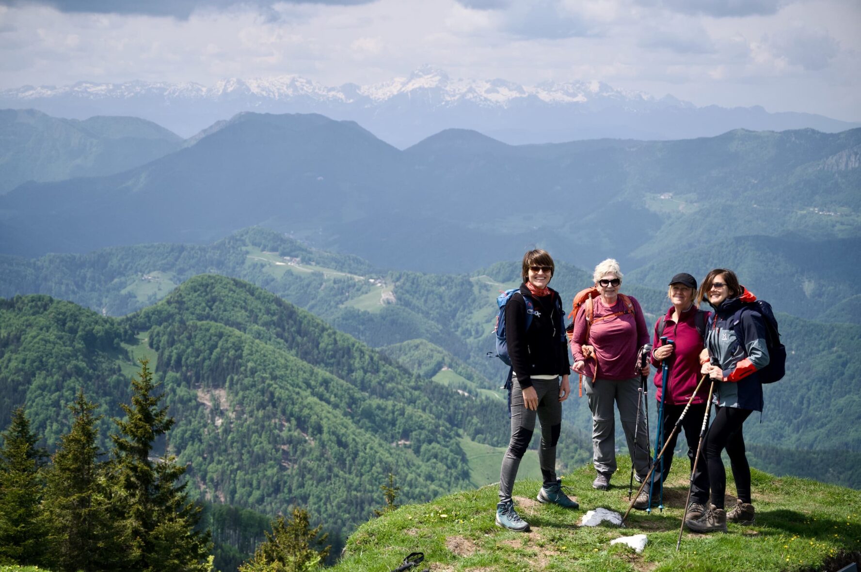 Hikers on a viewpoint in the Slovenian Alps