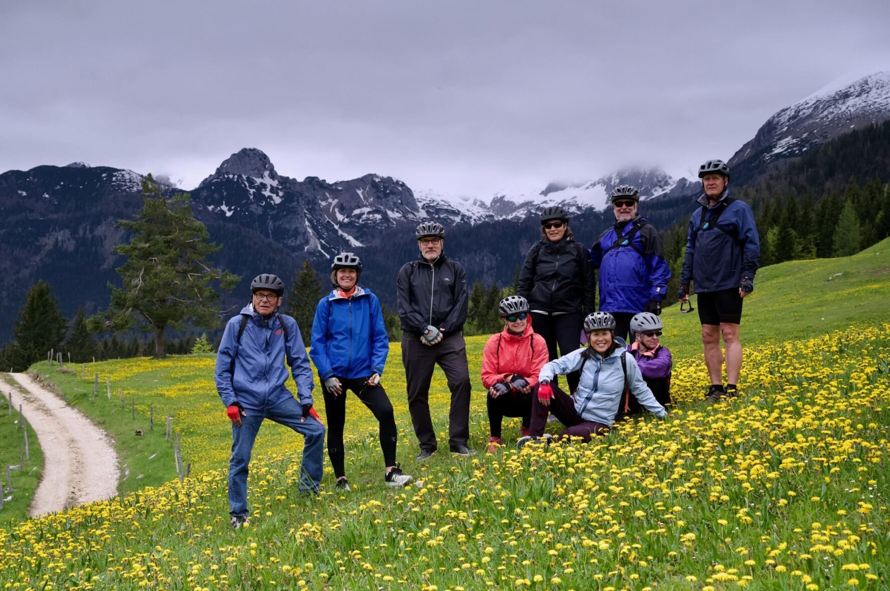 Hiking & e-MTB group in a valley in Slovenia with Alpine peaks in the background