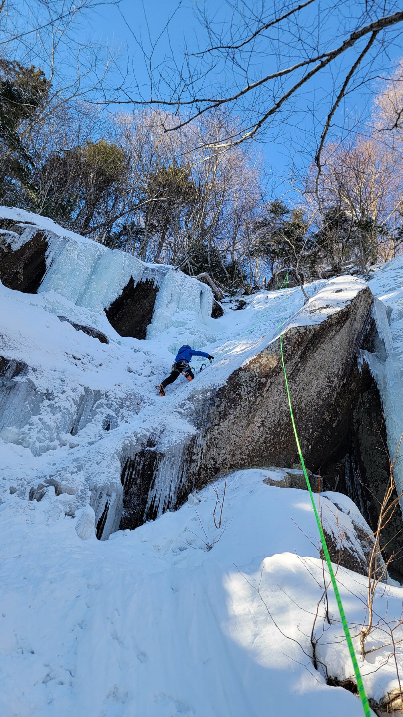 Ice climbing a steep slope in New Hampshire