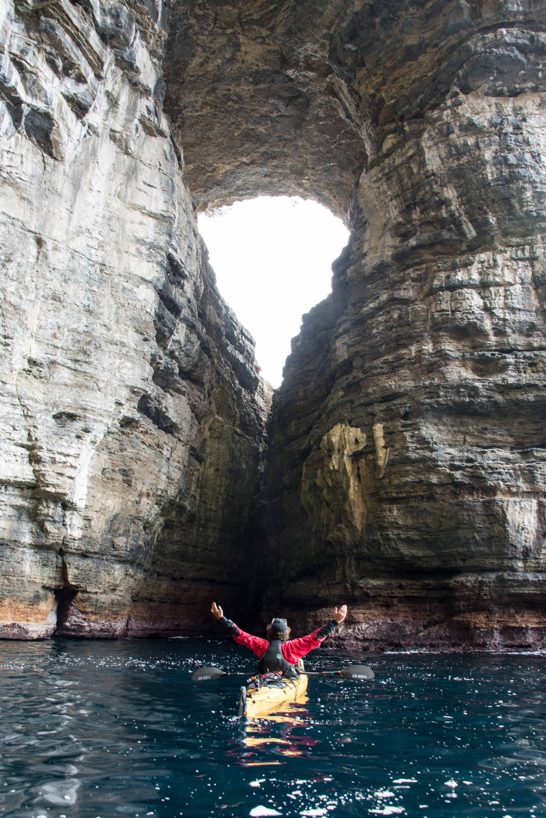 Kayaker in front of the Tasman Arch