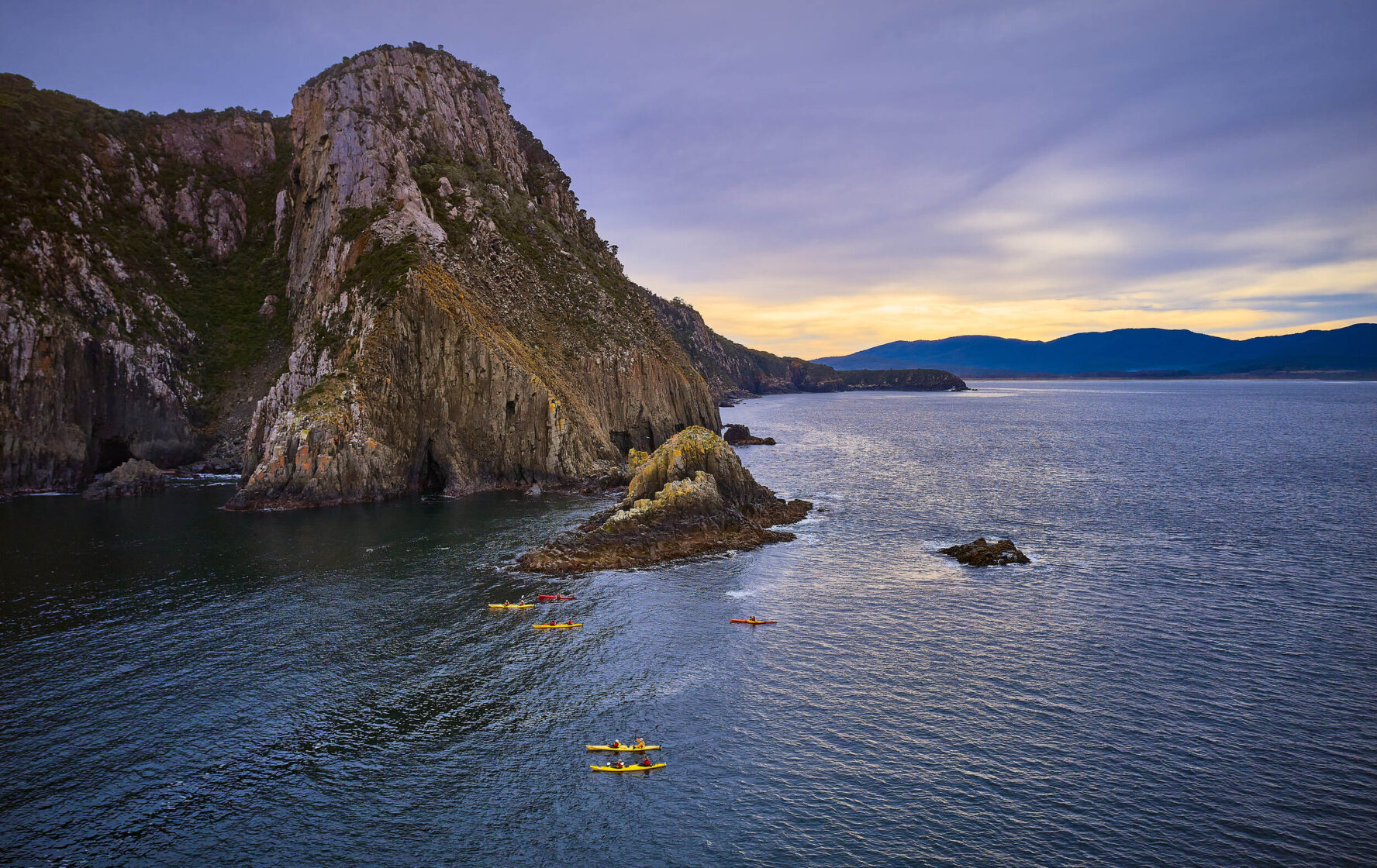 Kayaks near the cliffs of Bruny Island