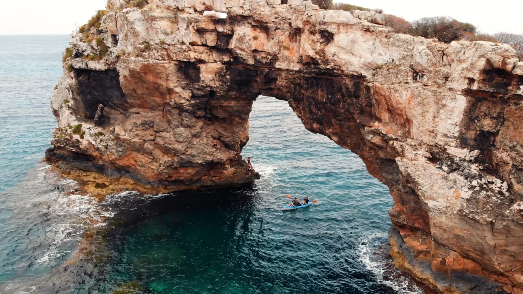Climbers paddling to a spot in Mallorca