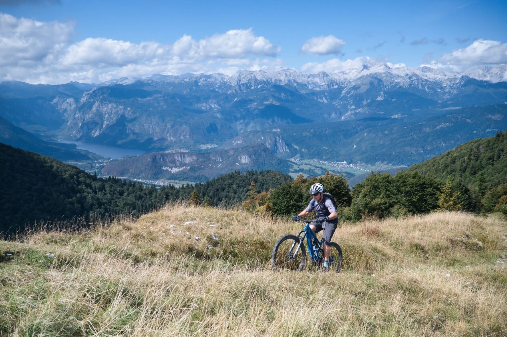 Man on an e-MTB Julian Alps surrounded by mountain scenery