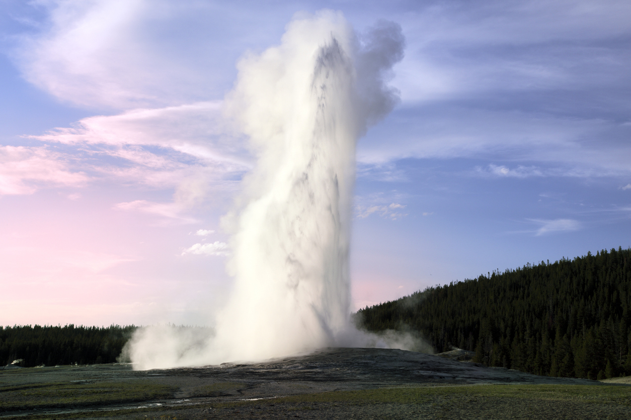 The Old Faithful geyser in the evening