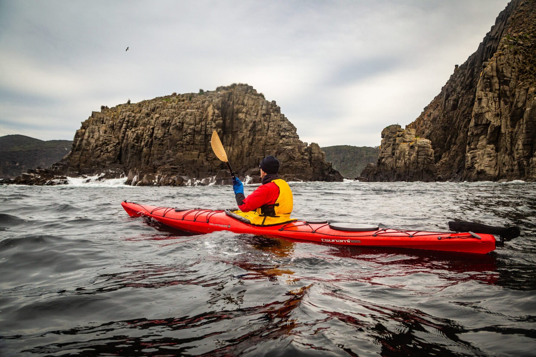 Paddling near the rocky formations of Bruny Island