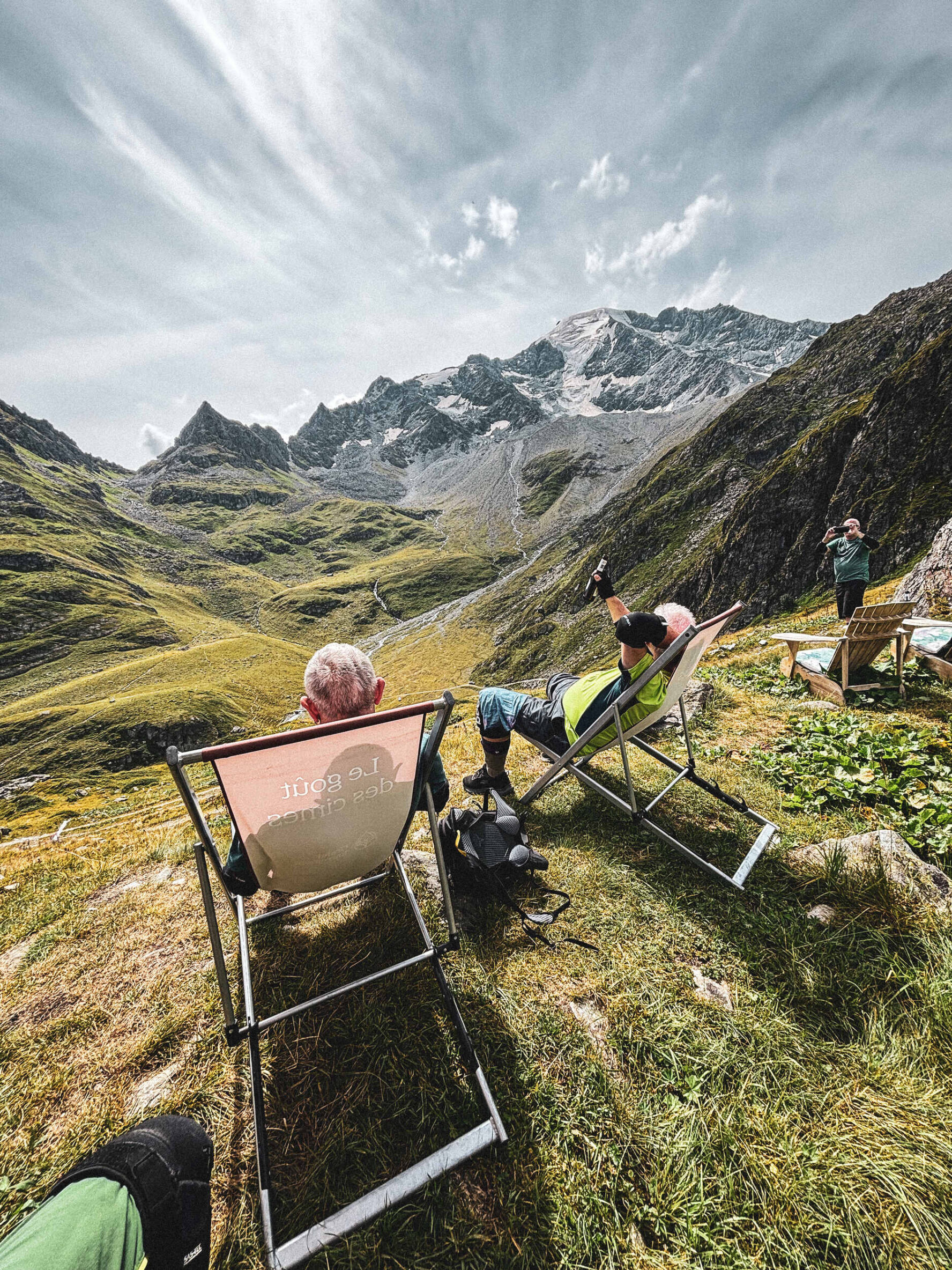 Relaxing on deck chairs in a mountain valley in Valais