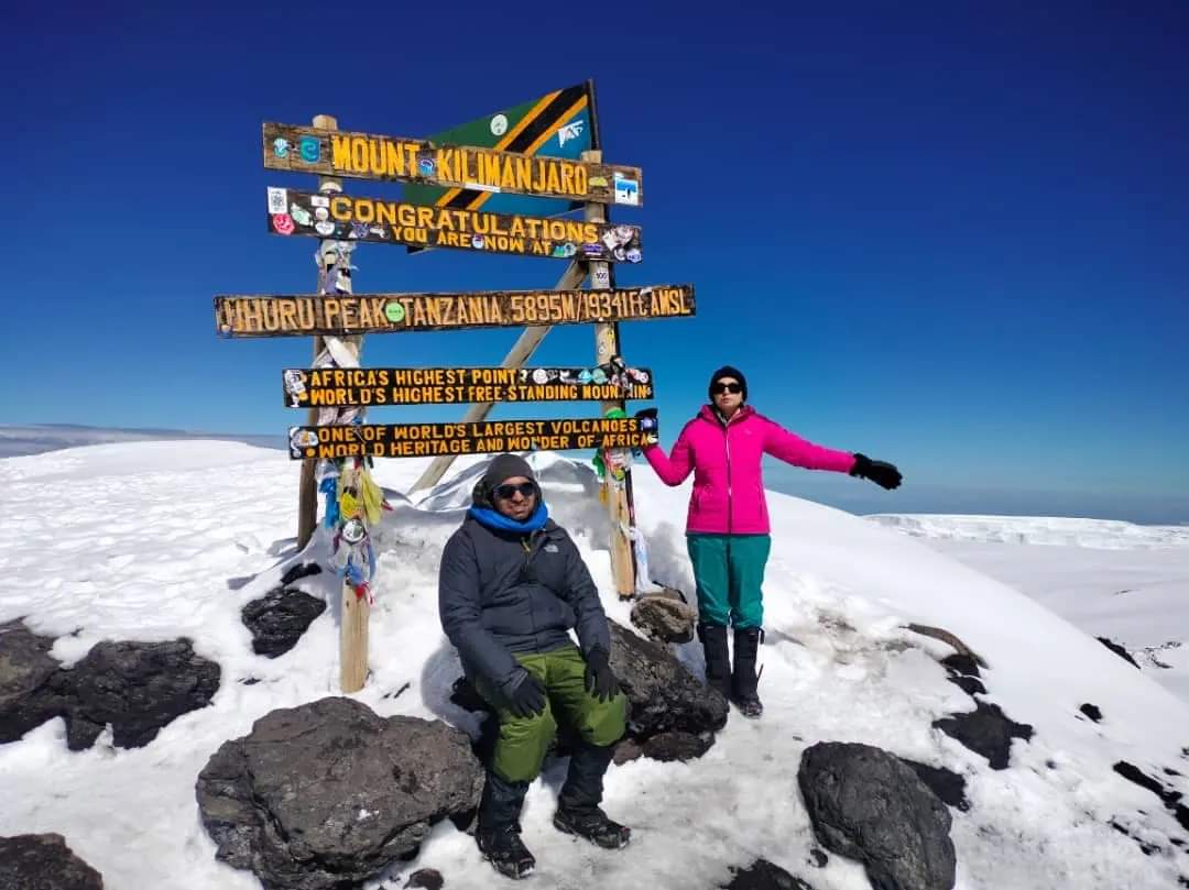Hikers at the top of Mt. Kilimanjaro